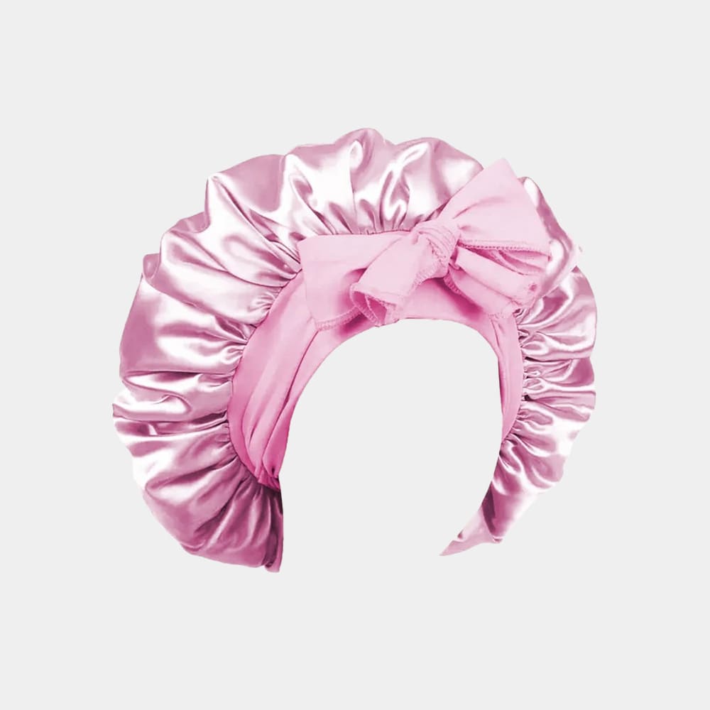 Bonnet de nuit en satin rose clair avec nœud ajustable